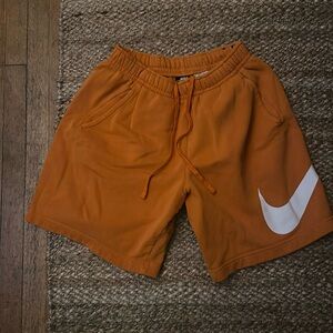 Boys nike shorts orange with white swoop, Size Small, Lightly worn
